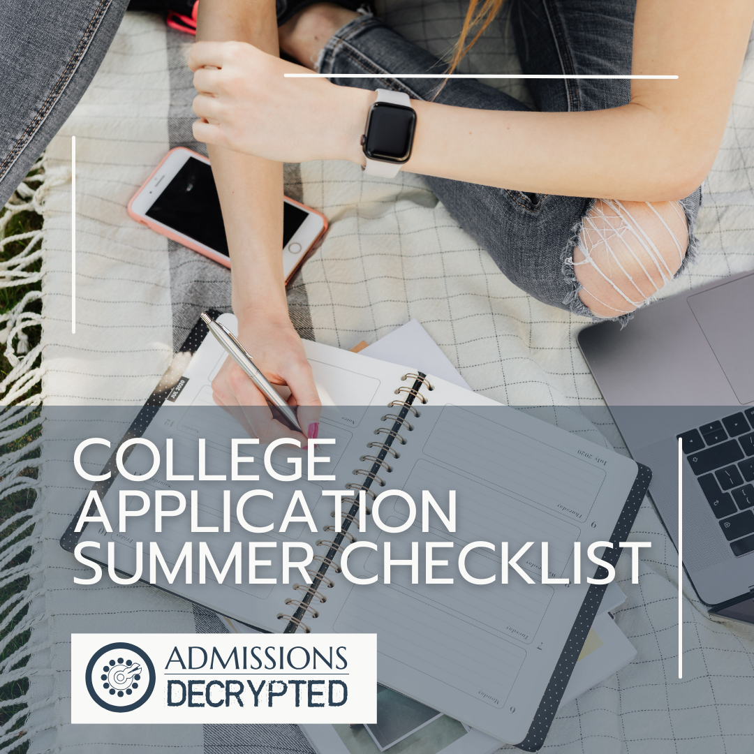Student fills out college planner on a blanket on a summer day.