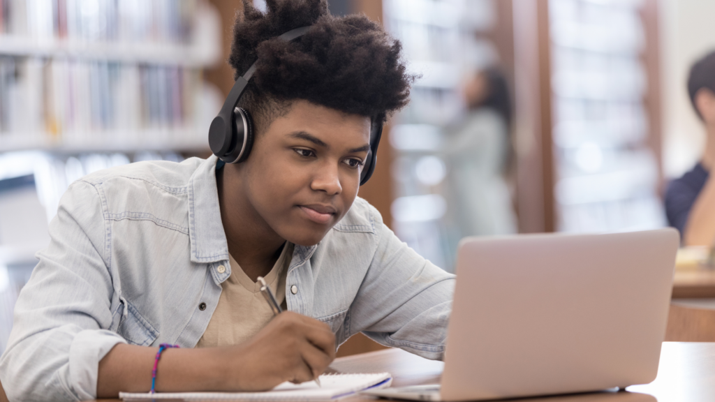Young man prepping their college application essay